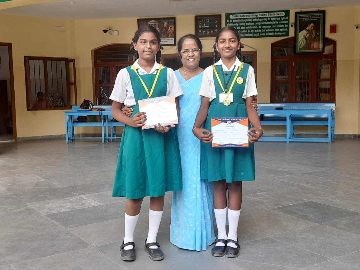 Sakthiyasri (VIIA) and Jenola Pascaline P (VIA) received gold medals and certificates for top scores in the Olympiad Exam conducted by Loyola Academy of Excellence.